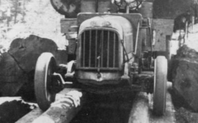 A Federal Logging Truck Hauling Timber Over A Log Bridge